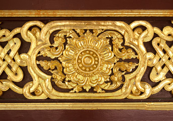 Pattern of flower carved on wood background