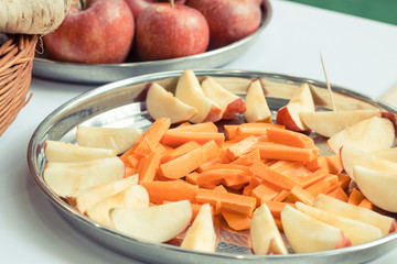 Fresh fruits and vegetables on plate as source healthy vitamins and minerals