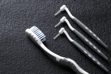 concept of dental health and orthodontics, toothbrush, dental floss, interdental brush and wax