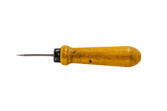 Old awl with a wooden handle isolated on a white background.