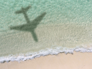 Fototapeta na wymiar Shadow Of An Aero Plane Flying Over Beach
