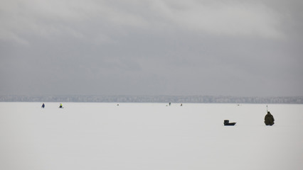 winter fishing on ice, natural background.Fishermen on the lake.