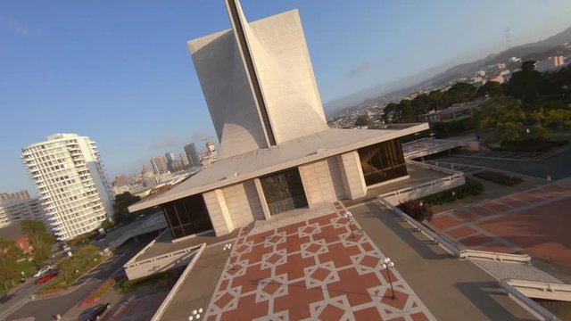Drone flying up and over the Cathedral of St. Mary of the Assumption, the mother church of the Archdiocese of San Francisco. Then falling, twisting down towards the Catholic church.