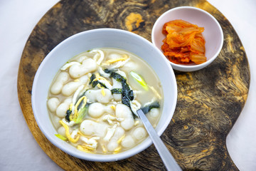 Korean style rice cake soup which is called Jolaeng-i Ddukkuk eats on the Lunar moon new year