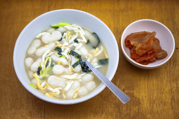 Korean style rice cake soup which is called Jolaeng-i Ddukkuk eats on the Lunar moon new year