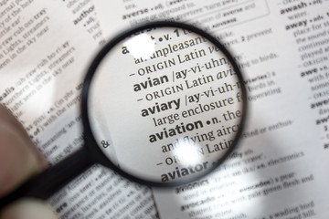 The word of phrase - aviary - in a dictionary.