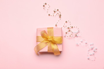 Beautiful gift on color background