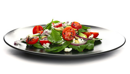Plate with fresh salad on white background