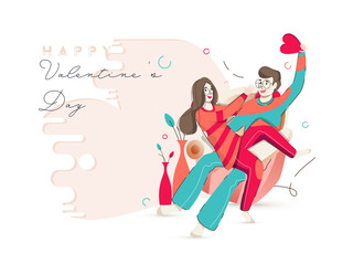 Young boy holding a red heart tease to his girlfriend on sofa for Happy Valentine's Day Celebration Concept.