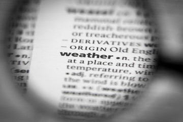 Fototapeta premium Word or phrase weather in a dictionary.