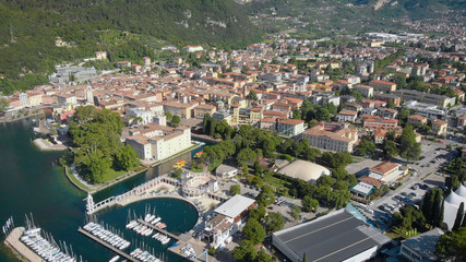 Fototapeta na wymiar aerial view of port city in sunny weather in summer, drone is flying up, showing panorama of town