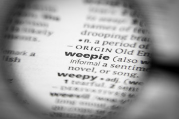 Fototapeta premium Word or phrase weepie in a dictionary.