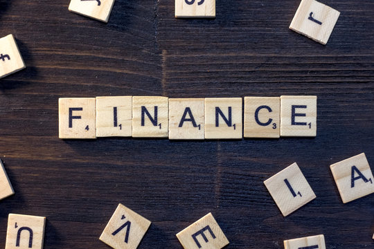 finance word made with scrabble letters.