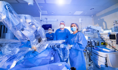 Minimal invasive robot surgical system in hospital. Robotic technology equipment, machine arm surgeon in futuristic operation room.