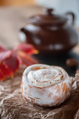 Freshly baked sweet rolls on a beautiful old Board. Close up