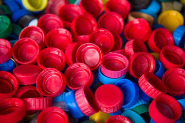  background. Cap material is recyclable.Remove lids from plastic bottles before recycling them. Recycling collection and processing plastic bottle caps