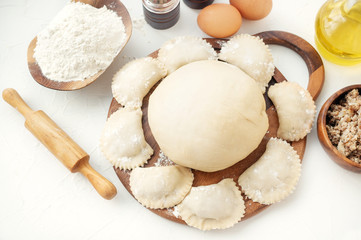 Cooking homemade dumplings from raw homemade dough. National cuisine of Slavic peoples