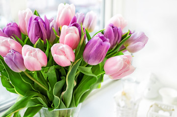 Beautiful bouquet of pink and purple tulips. Close up. A gift for a holiday or birthday.