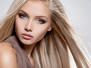 Beautiful young woman with long straight white hair