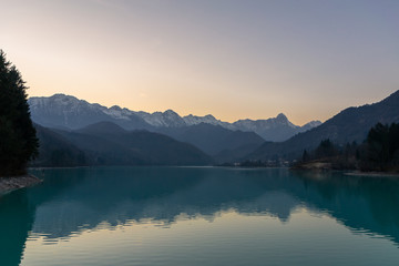 The twilight sunset over the lake Barcis, Italy