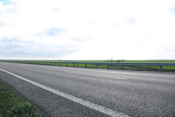 Beautiful view of asphalt highway without transport