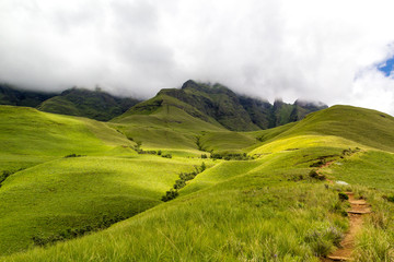 Small path leading to Blindman's Corner, green meadows and soft green mountains, Monk's Cowl,...