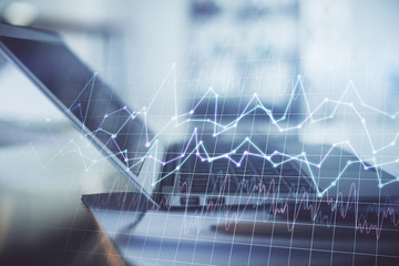Forex graph hologram on table with computer background. Double exposure. Concept of financial markets.