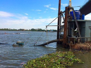 Dredger ,Dredging mud in the river for large boats to pass through