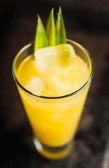 Pineapple cocktail in highball glass. Selective focus. Shallow depth of field.
