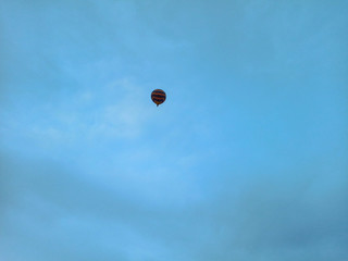 Colorful Hot Air Balloons flying over Cappadocia early morning at winter with dark morning in Turkey