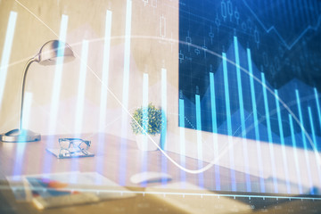 Obraz premium Forex Chart hologram on table with computer background. Multi exposure. Concept of financial markets.