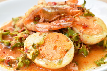 spicy and sour wing bean slice with minced pork topping boiled egg and shrimp Thai salad on dish