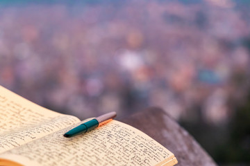 A journal notebook placed outdoors in open. selective focus.