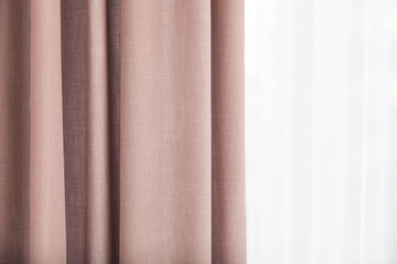 Fototapeta premium Window with elegant curtains indoors, closeup view