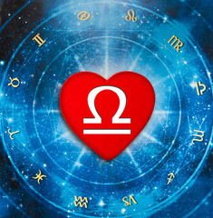 romantic red heart with zodiac symbol Libra over blue horoscope like astrology and love and...