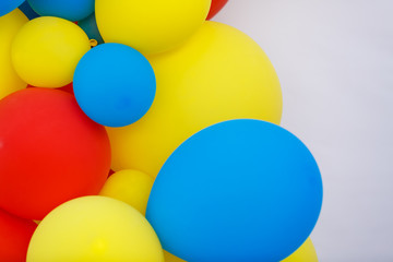 Bunch of colored balloons. Red, yellow, and blue baloons. Colorful background or wallpaper image