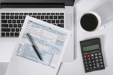 Naklejka na ściany i meble Tax Planning. Income Tax Form, Laptop and Calculator.
