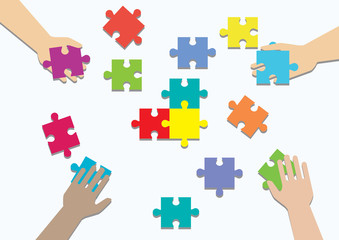 Concept of teamwork and integration with businessman holding colorful puzzle