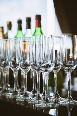 Empty champagne glasses in row on evening event