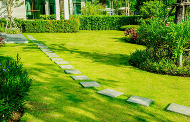 Pathway in garden, Green lawns with bricks pathways, Garden landscape design, Curve walkway on green grass field and flower garden, House in the garden, path in the garden.