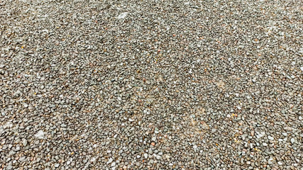 Lots of small gray wet rock stones on the road in Anatolia