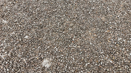 Lots of small gray wet rock stones on the road in Anatolia