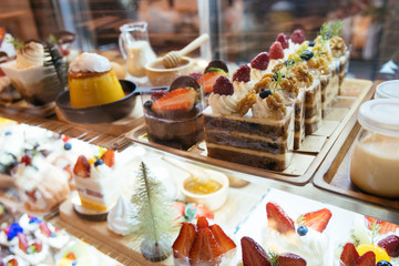 Pastry shop glass display with selection of cake