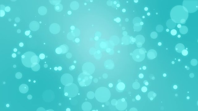 Magical turquoise blue animated background with floating bokeh light particles.