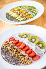Healthy smoothie bowl with fruit and grains