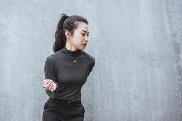 Urban young woman holding a cigarette