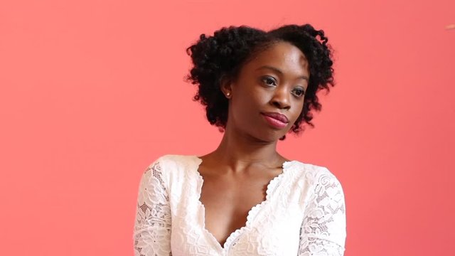 confident woman in white lace dress crossing her arms