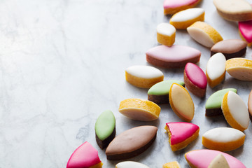 Calissons assortment on marble background. Traditional French Provence sweets. Copy space.