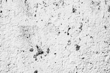 Texture of a concrete wall with cracks and scratches which can be used as a background