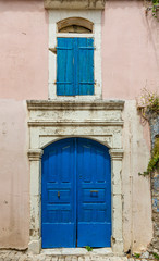 Old and ruinous door in a old greek village during daytime